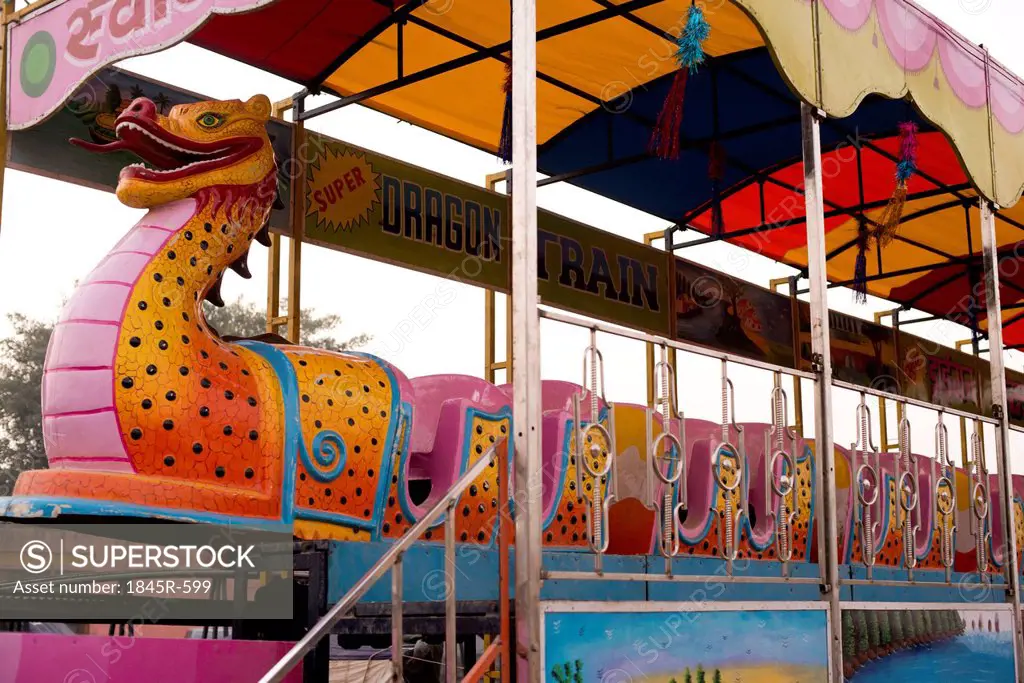 Dragon shaped roller coaster ride at Pushkar Camel Fair, Pushkar, Ajmer, Rajasthan, India