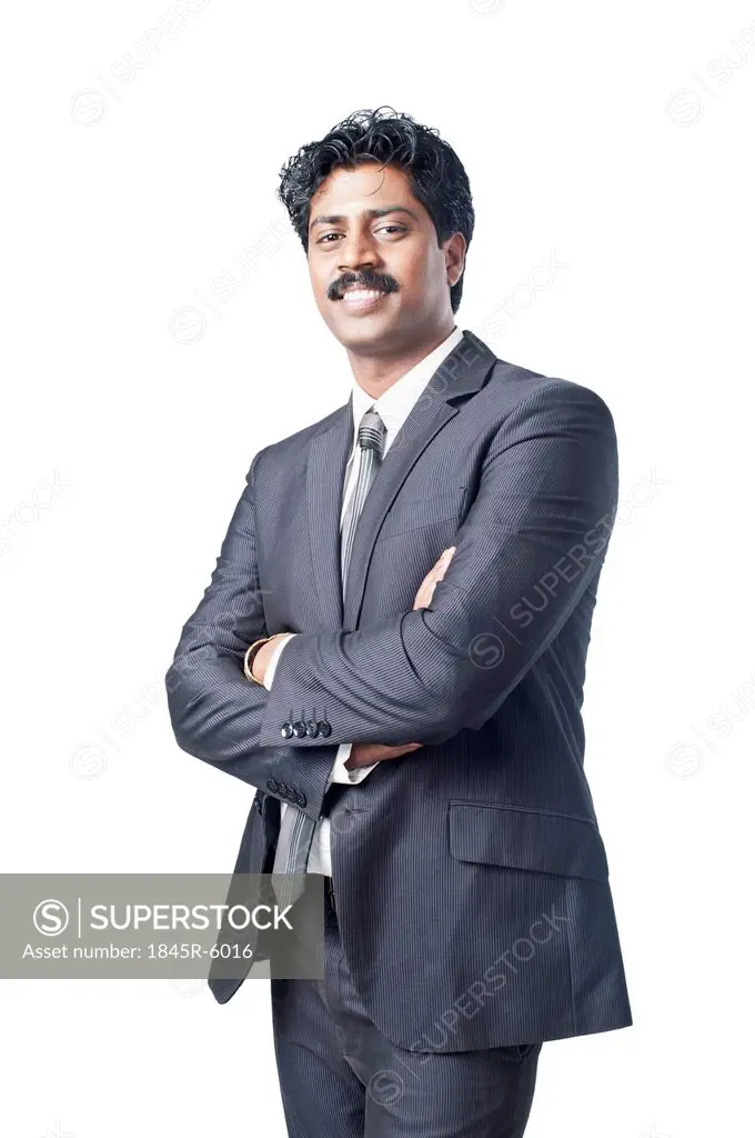 South Indian businessman standing with his arms crossed