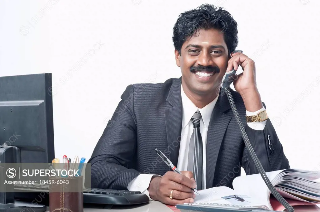 South Indian businessman working in an office