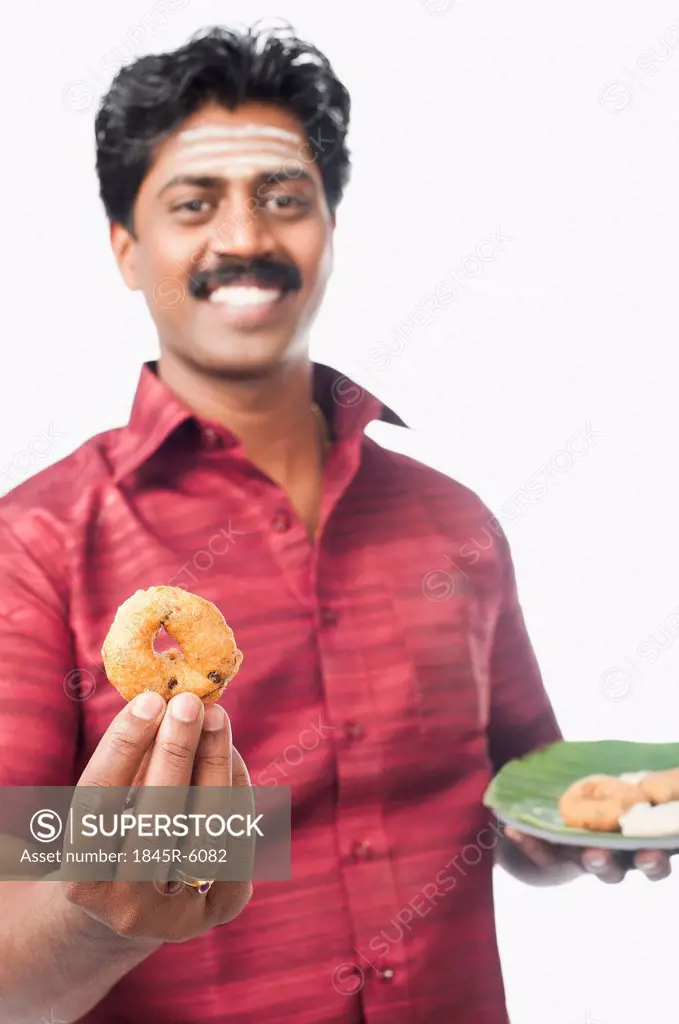 South Indian man having vada