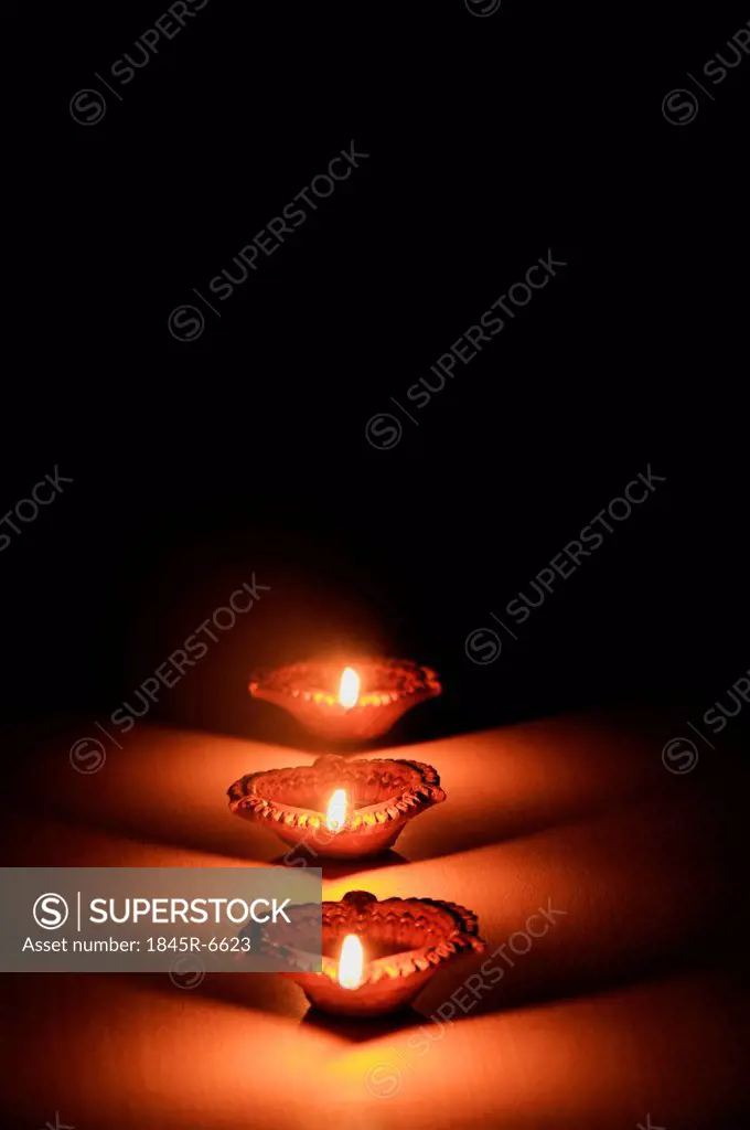 Close-up of Diwali oil lamps