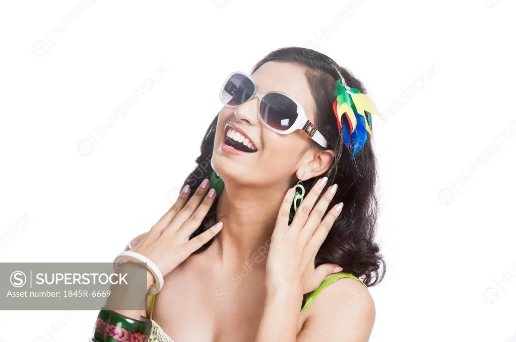 Beautiful young woman posing with sunglasses