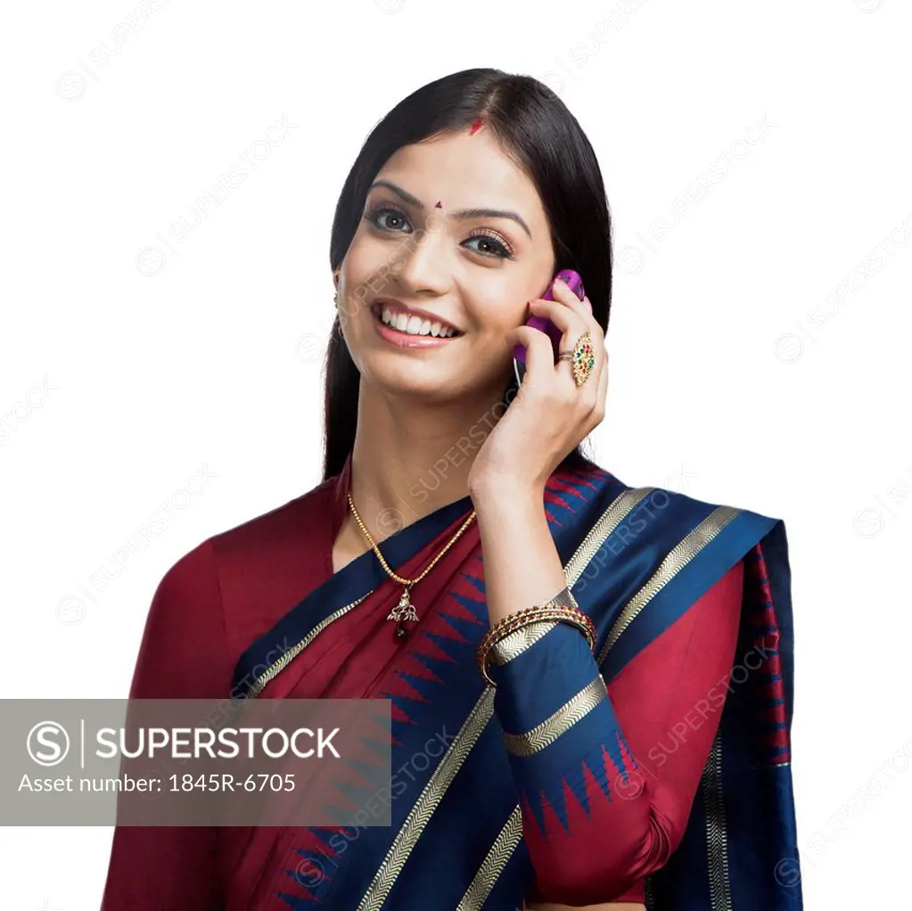 Traditionally Indian woman talking on a cell phone