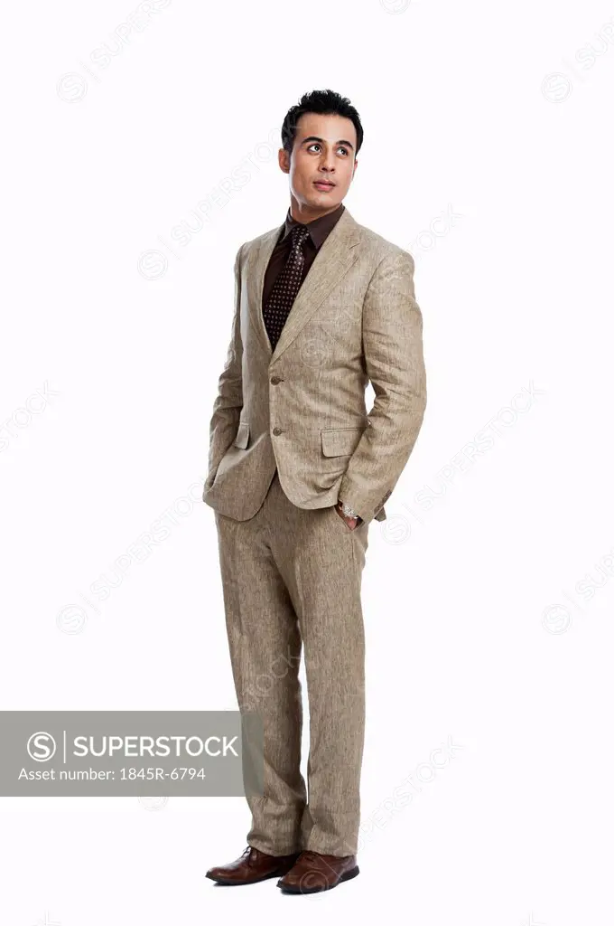 Close-up of a businessman standing with his hands in pockets