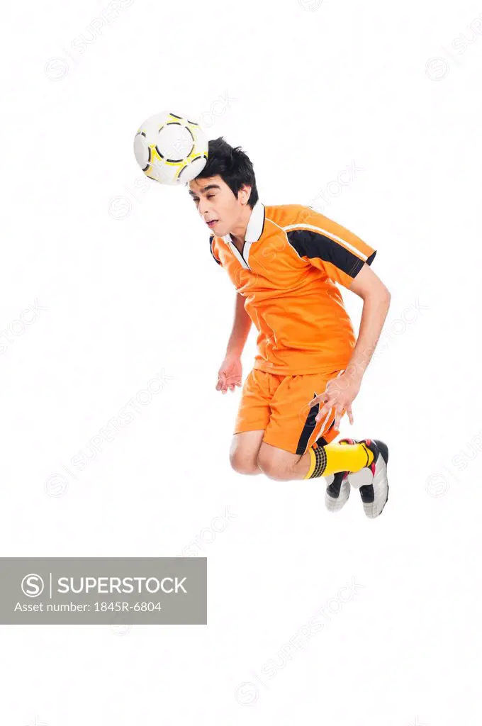 Soccer player heading a soccer ball