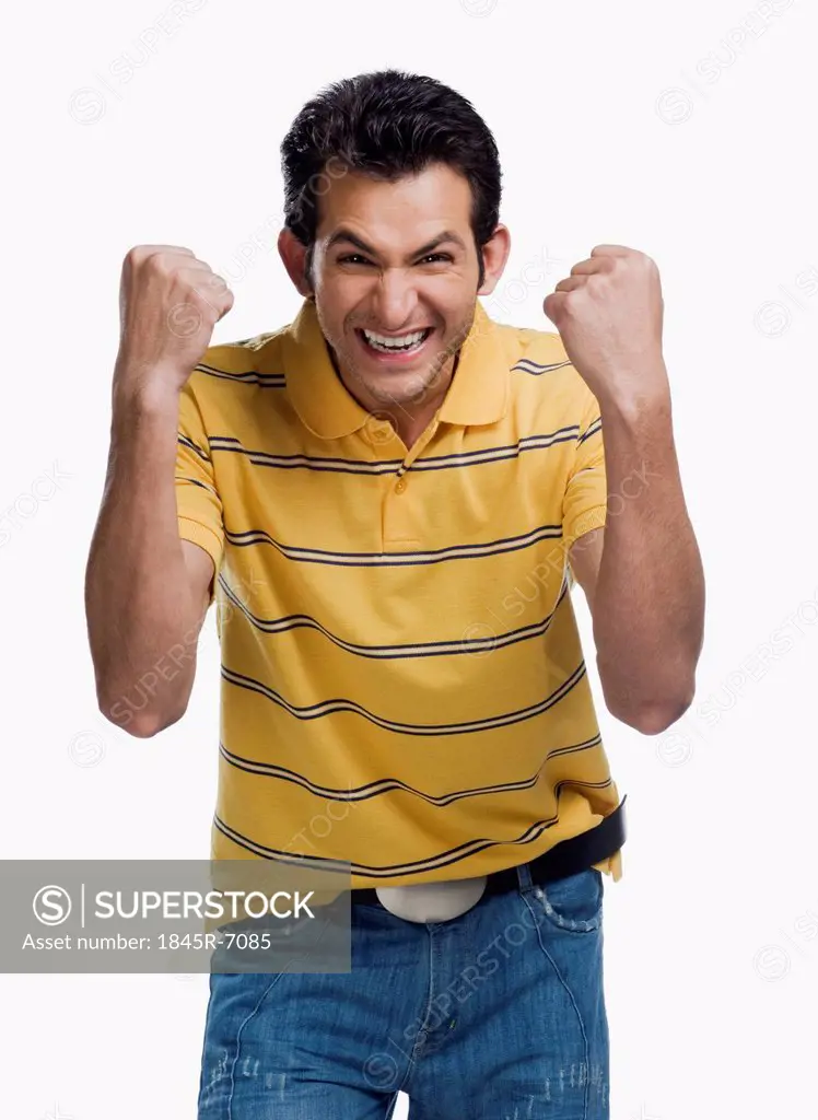 Portrait of a man clenching his fists in excitement