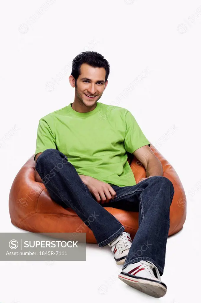 Portrait of a man sitting on a bean bag and smiling