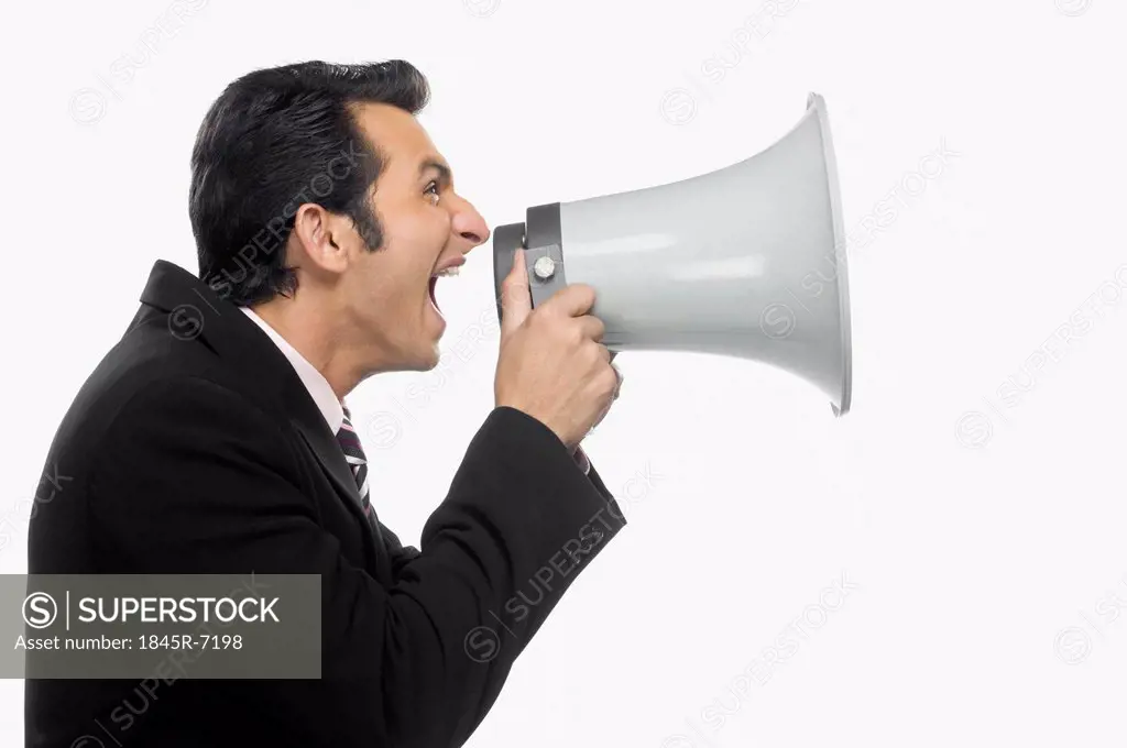 Businessman shouting into a megaphone