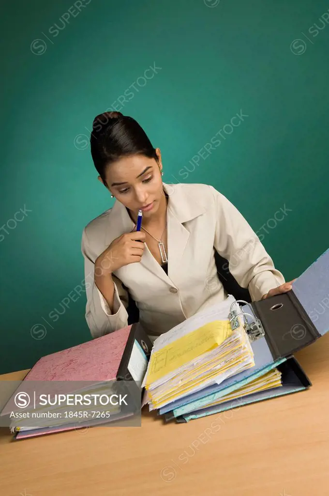 Businesswoman looking at files in an office