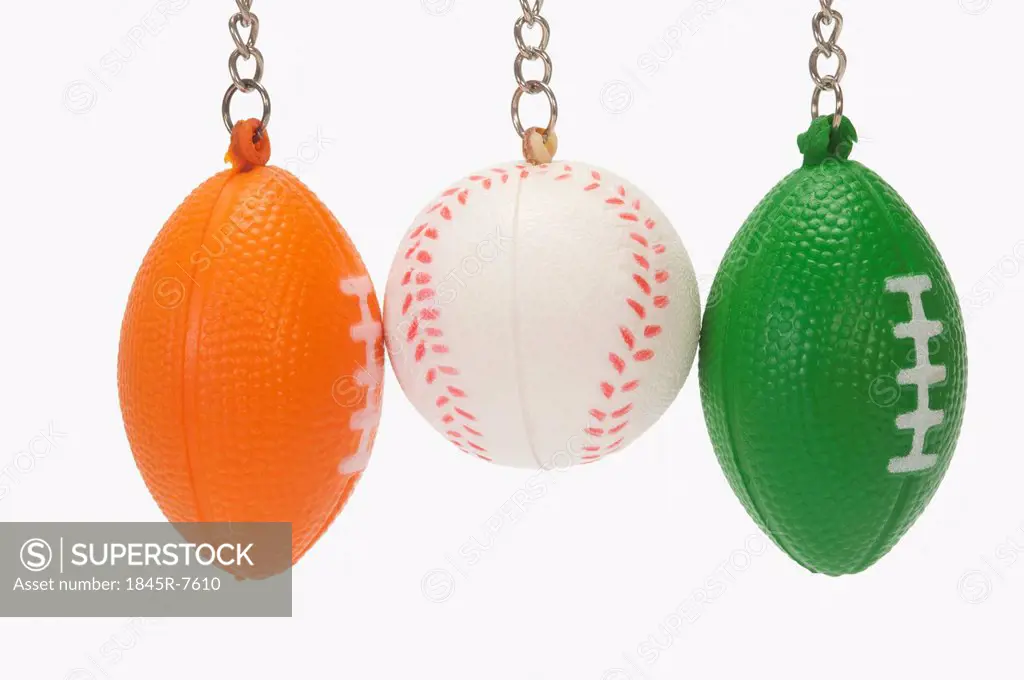 Close-up of assorted key rings of balls representing Indian flag colors