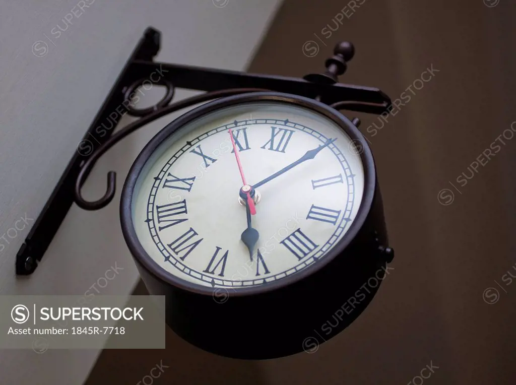 Low angle view of a clock on the wall