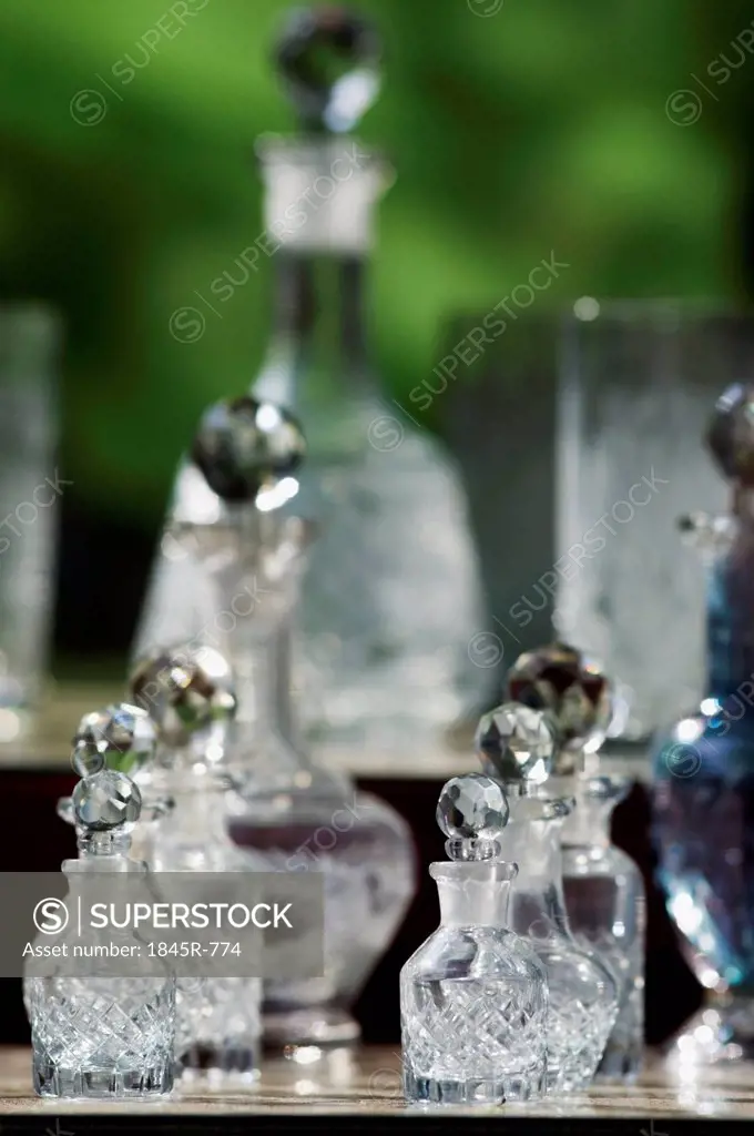 Display of glass perfume bottles for sale at market stall