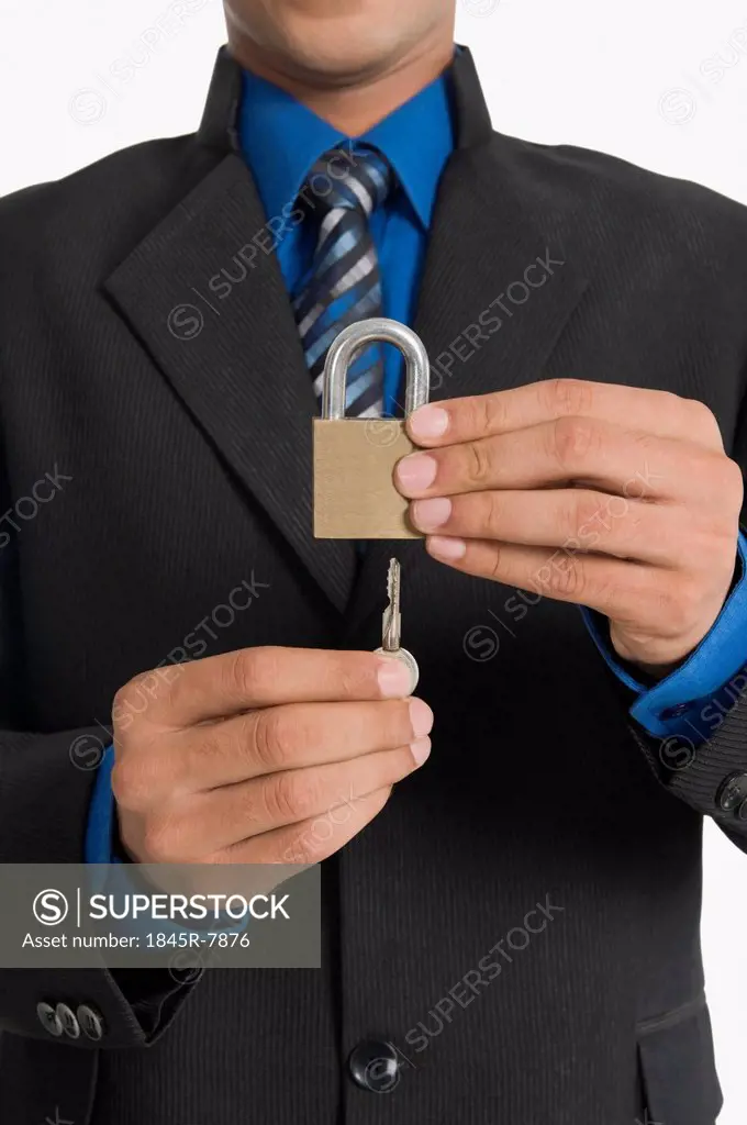 Real estate agent inserting a key in a lock