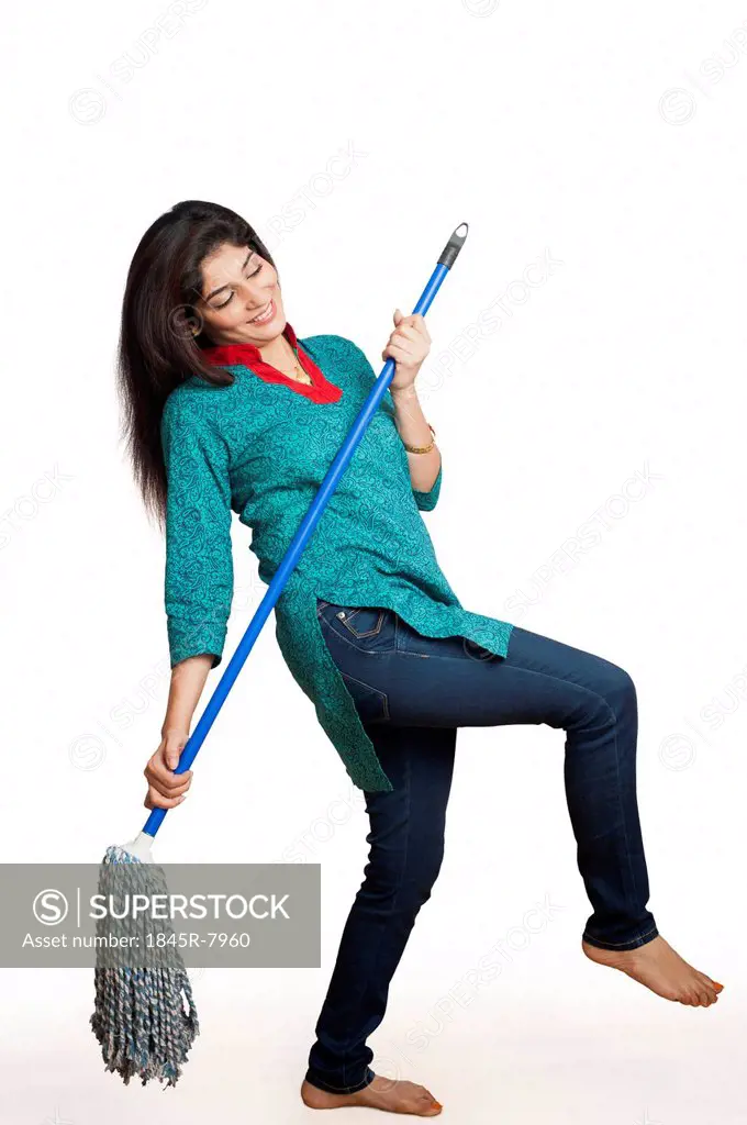 Woman cleaning floor with a mop
