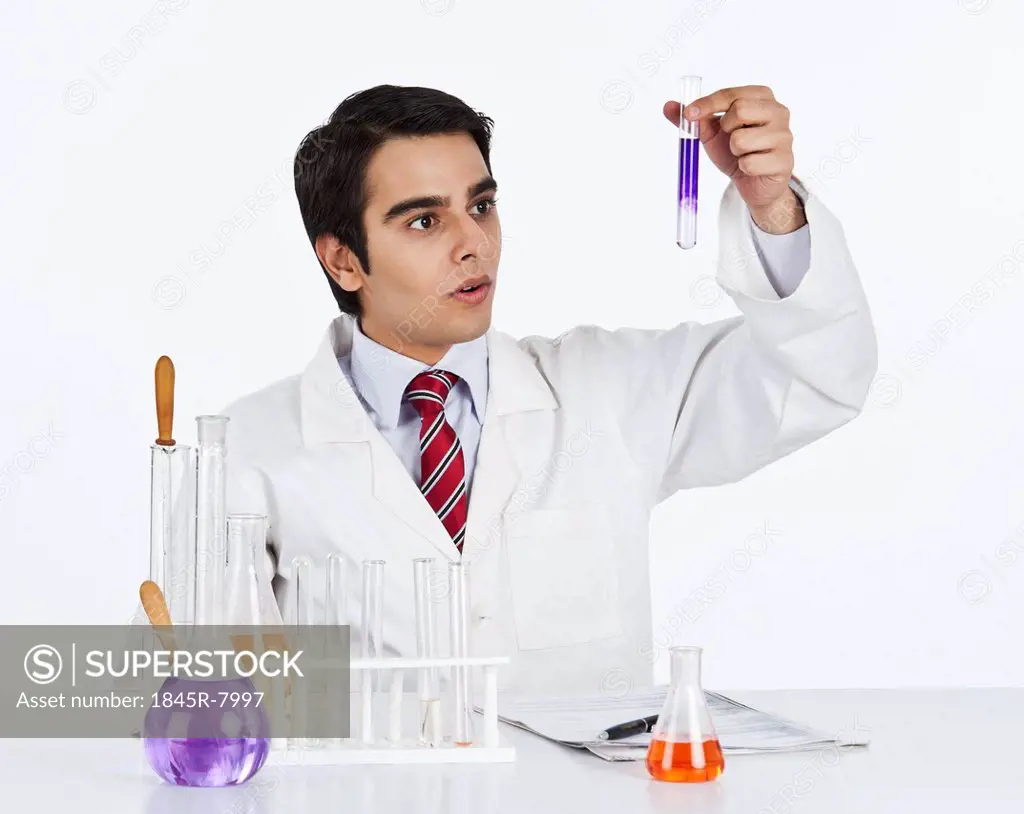 Male scientist doing scientific experiment in a laboratory