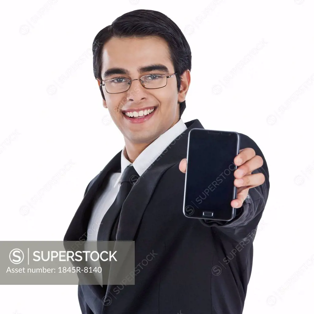 Businessman showing a mobile phone