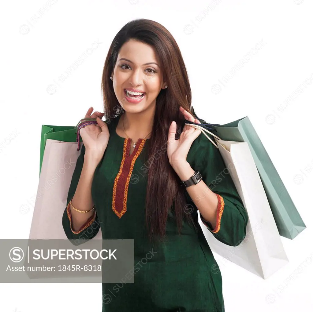 Portrait of a happy woman carrying shopping bags