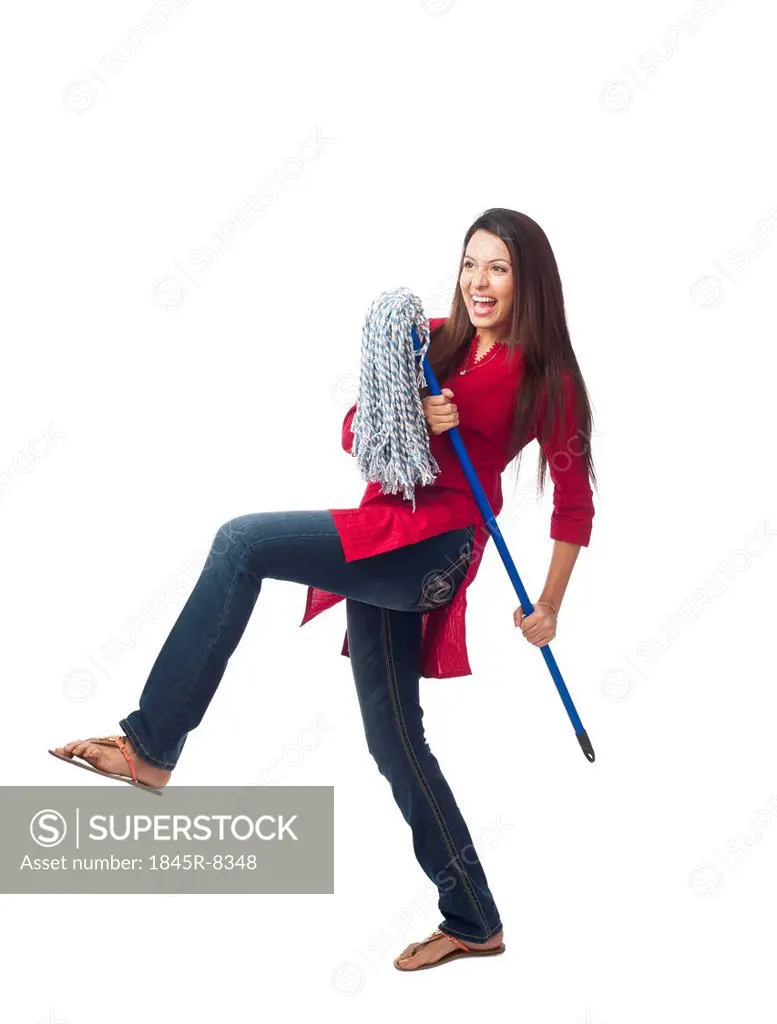 Happy woman posing with a mop