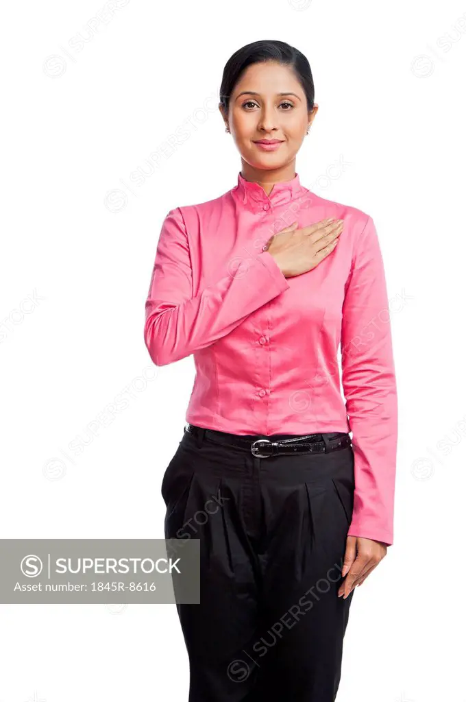 Portrait of a businesswoman with his hand on heart