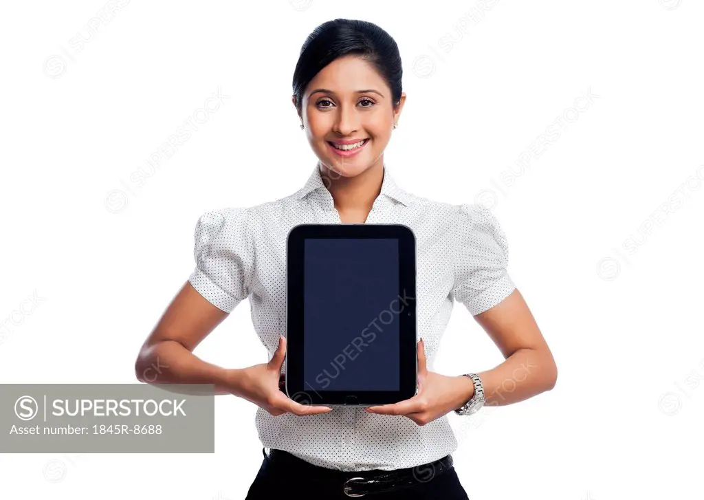 Portrait of a businesswoman showing a digital tablet and smiling