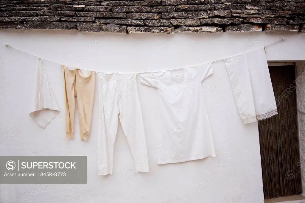 Clothes drying outside a trulli house, Alberobello, Bari, Puglia, Italy