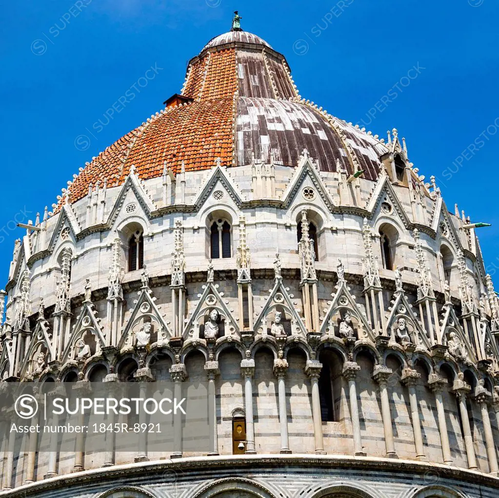 Low angle view of a religious building, Baptistery of St. John, Piazza Dei Miracoli, Pisa, Tuscany, Italy