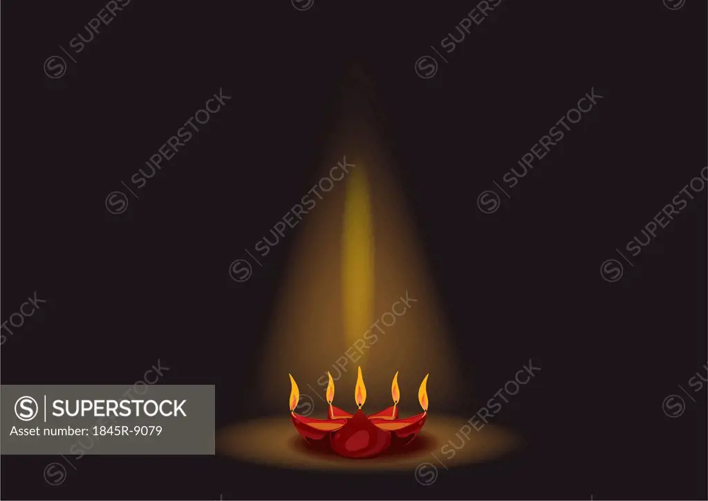 Glowing Diwali oil lamp isolated on black background