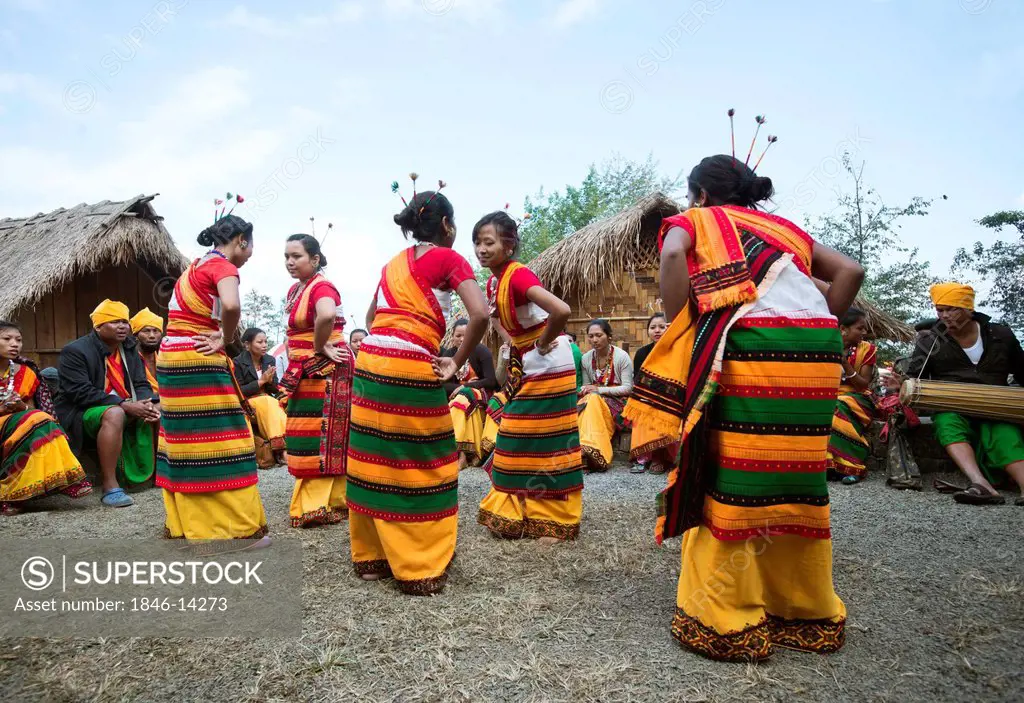 Naga tribal women in traditional outfit dancing in Hornbill Festival, Kohima, Nagaland, India