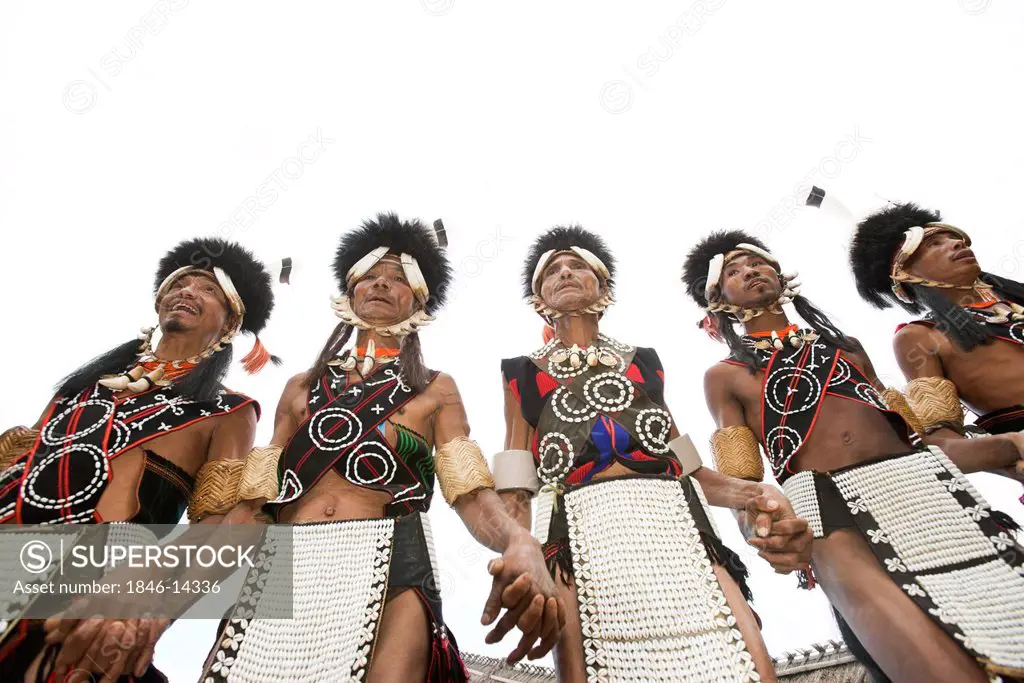 Naga tribal warriors in traditional outfit performing in Hornbill Festival, Kohima, Nagaland, India