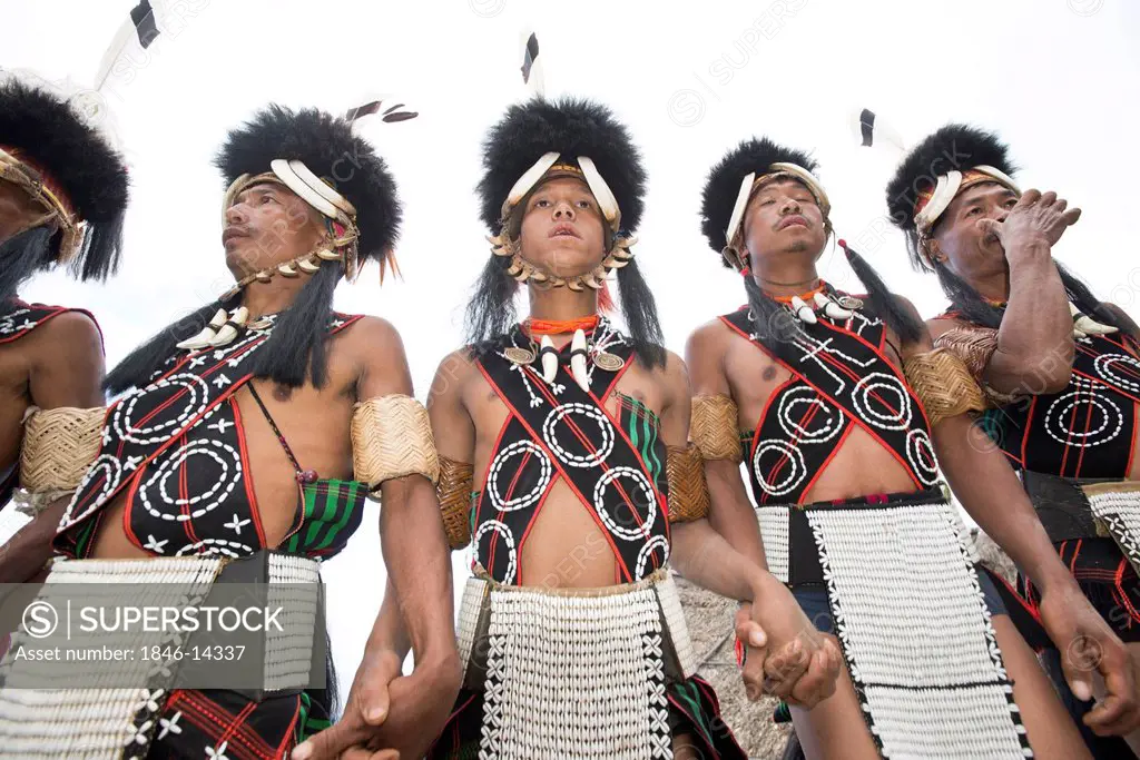 Naga tribal warriors in traditional outfit performing in Hornbill Festival, Kohima, Nagaland, India