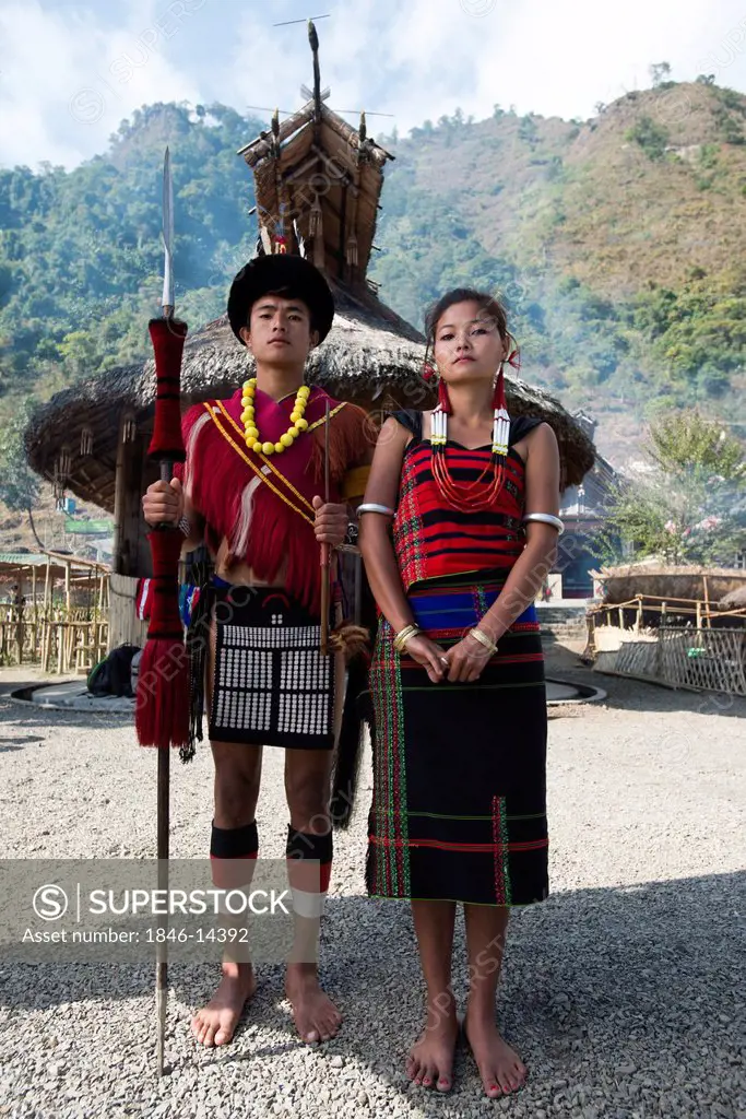 Naga tribal couple standing together in traditional outfit, Hornbill Festival, Kohima, Nagaland, India