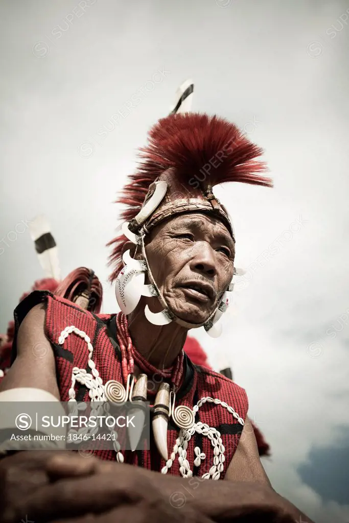 Naga tribal man in traditional outfit, Hornbill Festival, Kohima, Nagaland, India