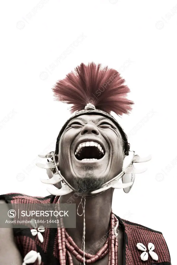 Naga tribal man laughing in traditional outfit, Hornbill Festival, Kohima, Nagaland, India