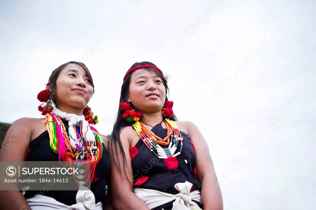 Two Naga tribal women smiling, Hornbill Festival, Kohima, Nagaland, India