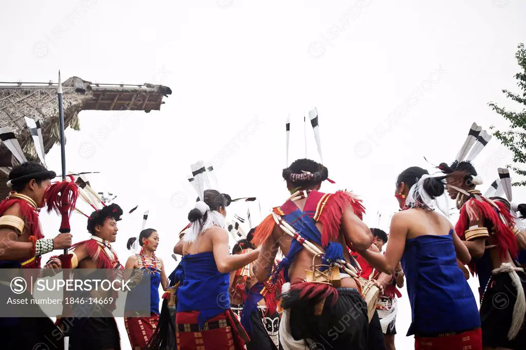 Naga tribal people dancing in traditional costumes, Hornbill Festival, Kohima, Nagaland, India