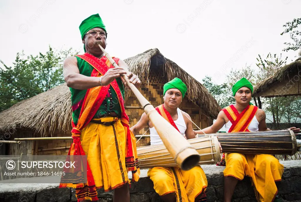 Naga tribal men playing traditional musical instruments, Hornbill Festival, Kohima, Nagaland, India