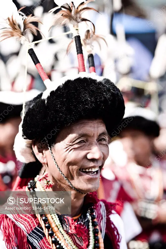 Naga tribesman laughing during the annual Hornbill Festival at Kisama, Kohima, Nagaland, India