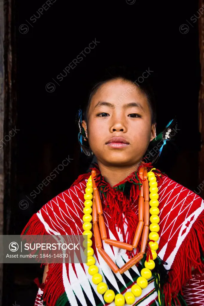 Naga tribal boy in traditional outfit during the annual Hornbill Festival at Kisama, Kohima, Nagaland, India