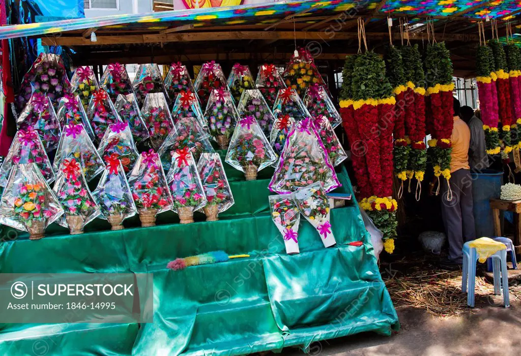 Bouquet of flowers with garlands at a market stall, Chennai, Tamil Nadu, India