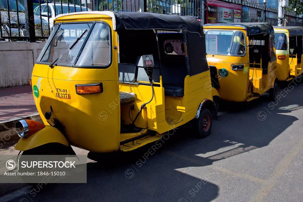 Auto rickshaws parked on a street, Chennai, Tamil Nadu, India