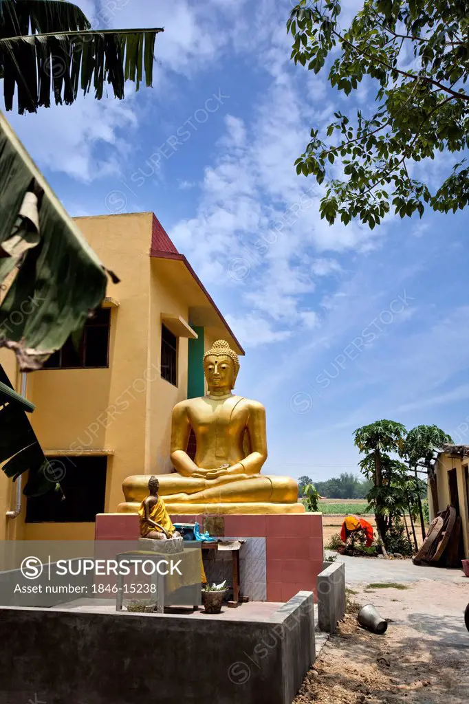 Buddha statue outside a temple, Shravasti, Uttar Pradesh, India