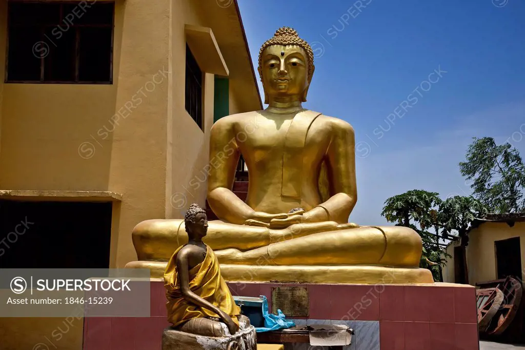 Buddha statue outside a temple, Shravasti, Uttar Pradesh, India