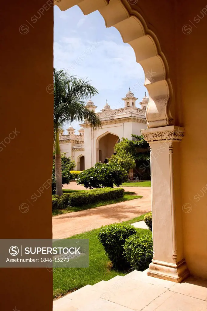 Formal garden of a Palace viewed through arch, Chowmahalla Palace, Hyderabad, Andhra Pradesh, India