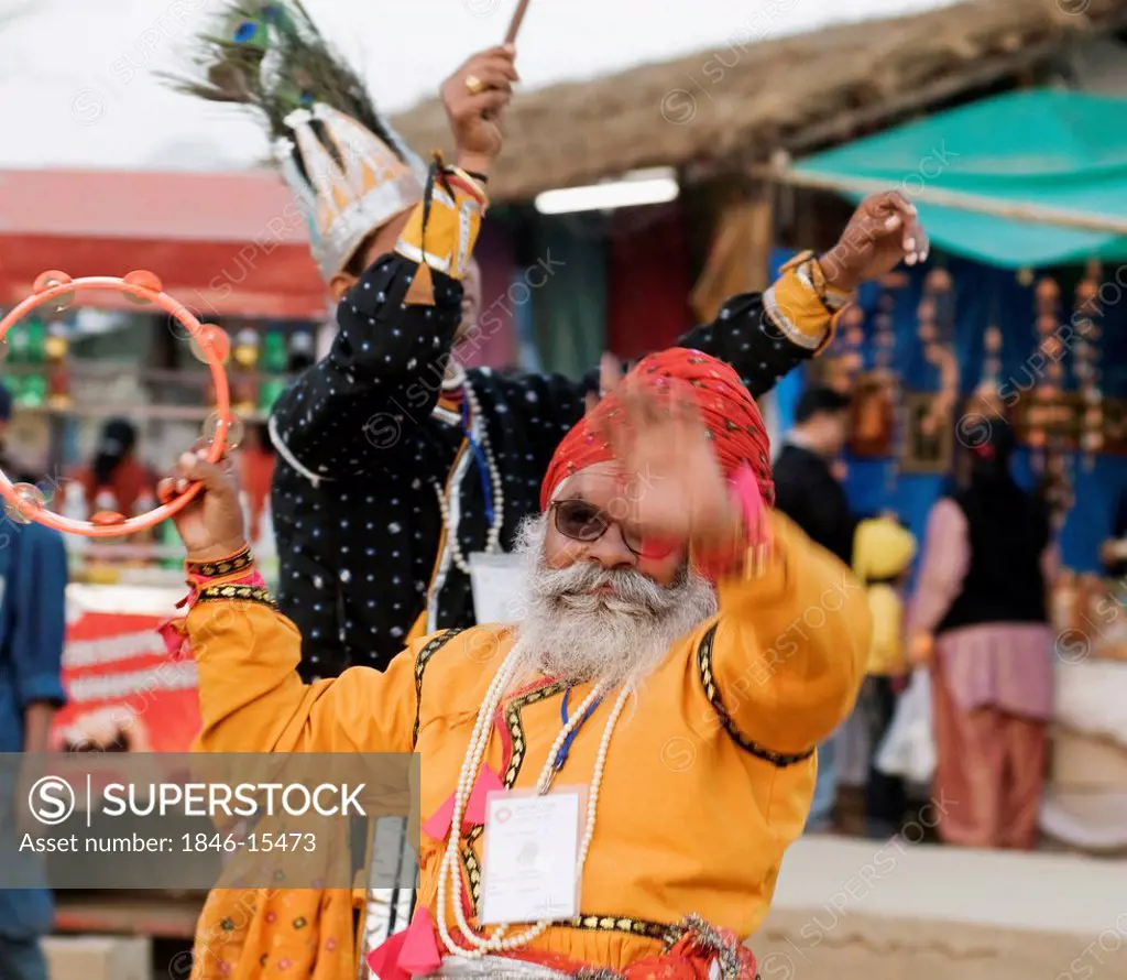 Two men dancing at Surajkund Mela, Faridabad, Haryana, India