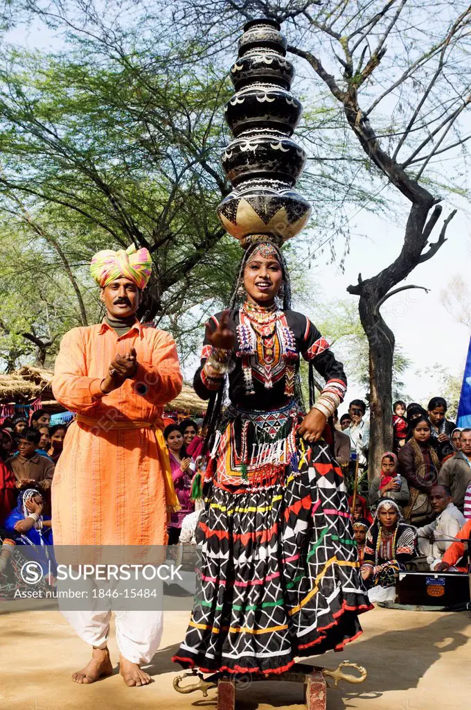 People in traditional Rajasthani dress performing kalbelia dance in Surajkund Mela, Faridabad, Haryana, India