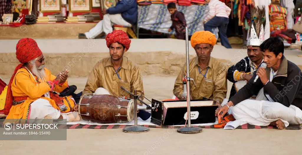 People in traditional Rajasthani dress playing music at Surajkund Mela, Faridabad, Haryana, India