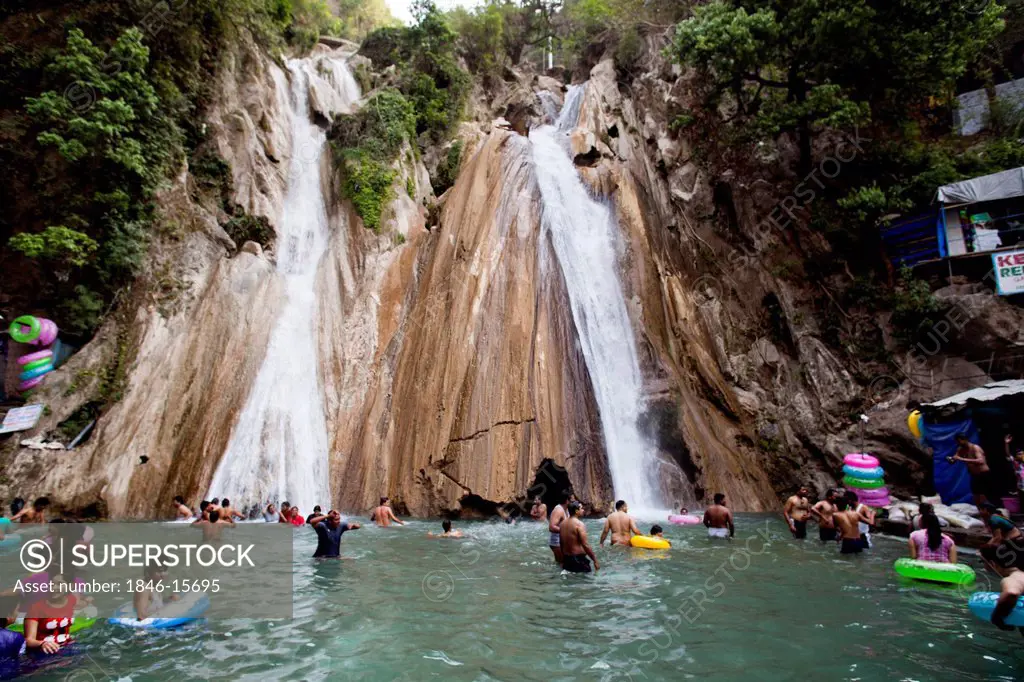 Tourists enjoying at waterfall, Kempty Falls, Chakrata Road, Mussoorie, Uttarakhand, India