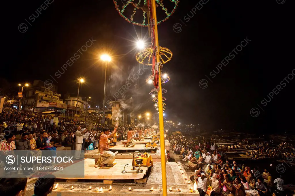 Pilgrims performing aarti at a ghat, Ganges River, Varanasi, Uttar Pradesh, India