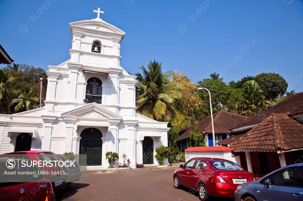 Cars parked outside a church, St Sebastian Chapel, Panaji, North Goa, Goa, India