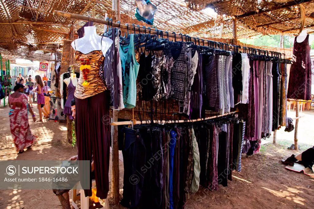 Clothes hanging at a store in the Anjuna Beach Flea Market, Anjuna Beach, Anjuna, Bardez, North Goa, Goa, India